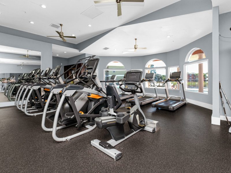 Modern fitness center with cardio equipment at TGM University Park gym.